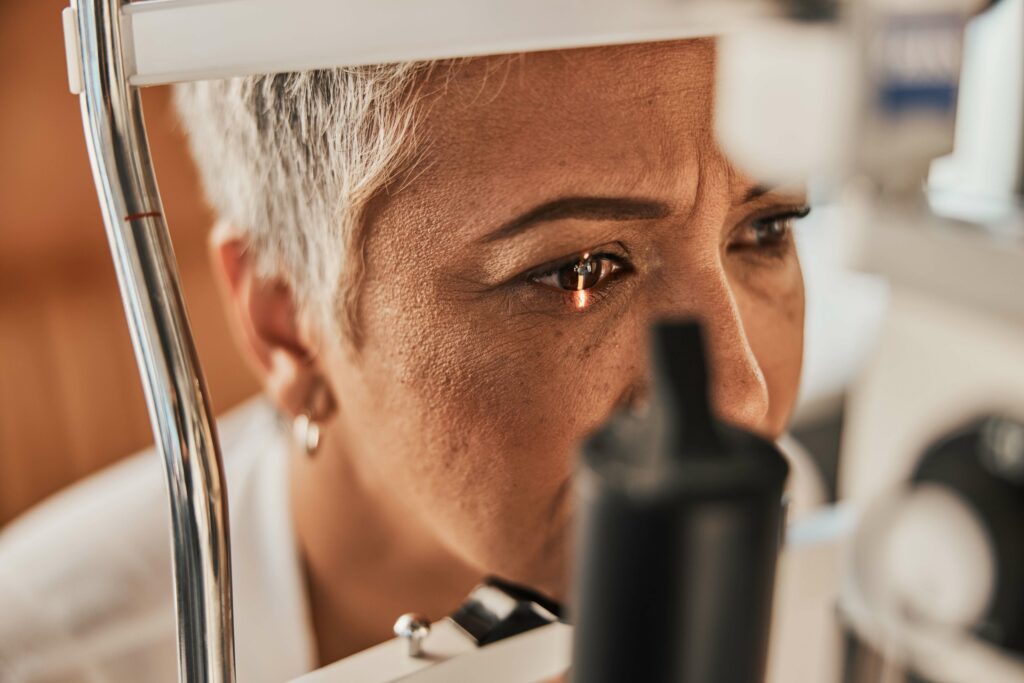 Close-up of a person undergoing a slit lamp exam