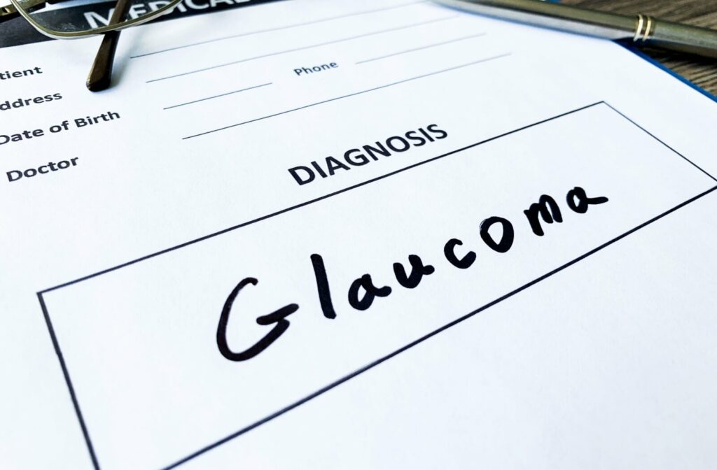 A medical diagnosis form on a clipboard with the word "Glaucoma" handwritten in large black letters in the diagnosis section.
